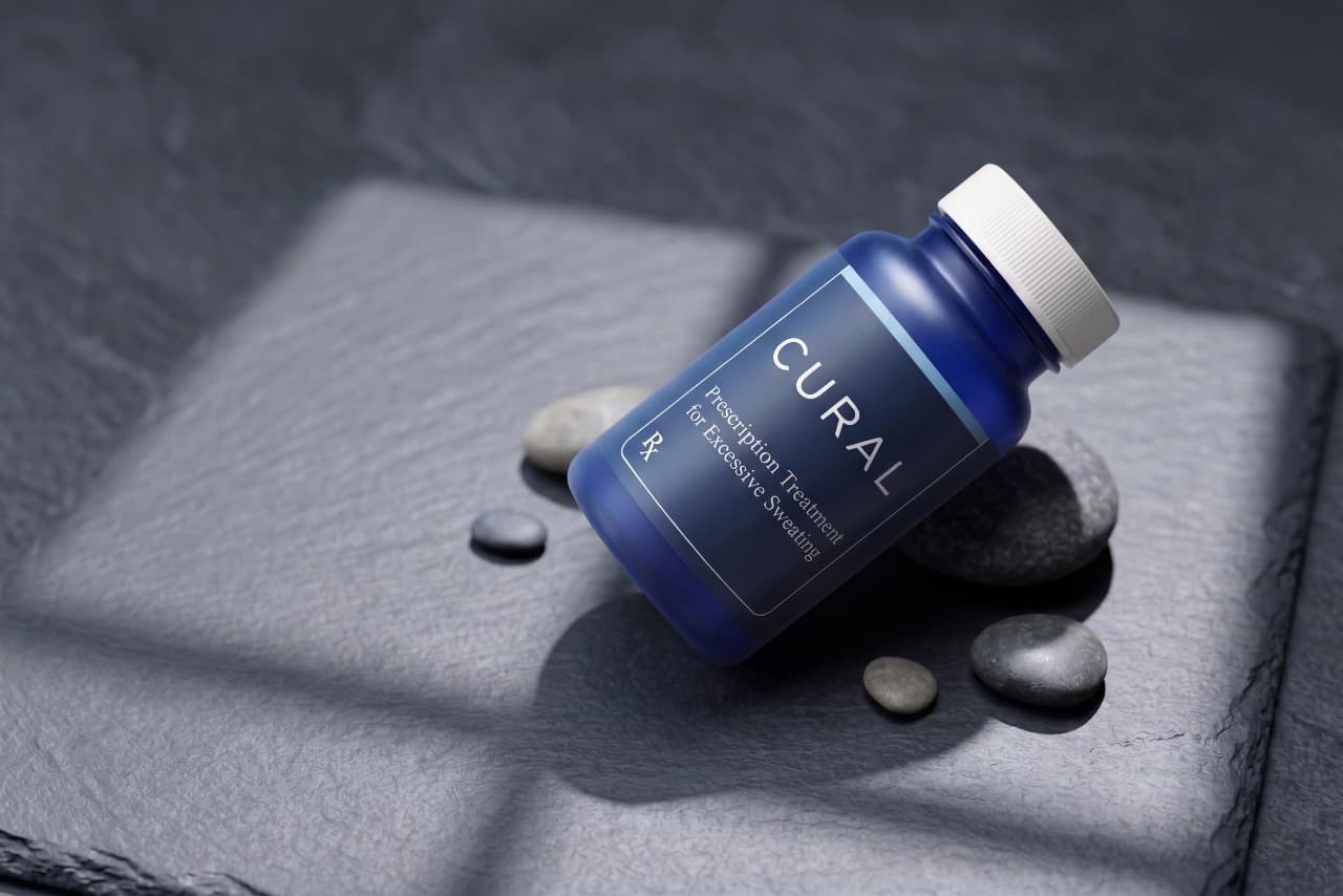 Cural prescription bottle on stone surface